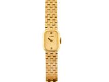 gros plan d'une montre-bracelet en or sur fond blanc