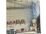 a mirror that is hanging on the wall in the kitchen