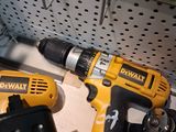 two power tools that are sitting on a shelf