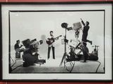 black and white photograph of a group of people playing instruments