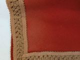 a close up of a piece of fabric with a crochet edge