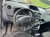 dashboard of a small car with a steering wheel and dashboard controls