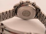 a close up of a wrist watch on a white surface