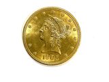 l'image d'une pièce d'or sur laquelle figure une tête de femme