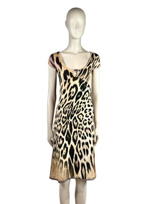 a mannequin wearing a leopard print dress on a mannequin mannequin