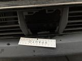 a sticker on the front bumper of a car that has a sticker attached to it