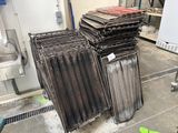 a lot of different types of metal sheets on the floor