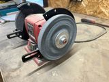 a picture of a grinder sitting on a table in a workshop