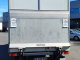 a white truck that is parked in a parking lot
