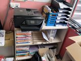 a room with a lot of boxes and a printer on it