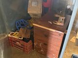 a small room with a desk and a cabinet in it