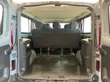the back of a van with the doors open and the seats down