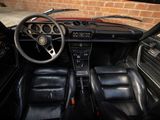 a black car with leather seats and a steering wheel