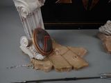 a statue of a warrior with a shield and a sword