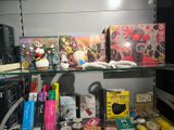 a shelf with many books and toys on it