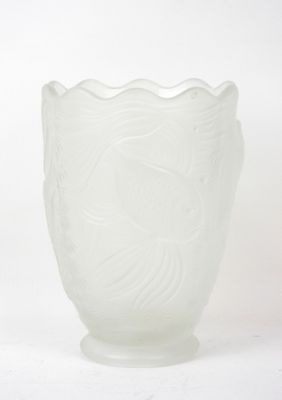 a white glass vase with a fish design on it