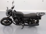 a black motorcycle that is parked in a room