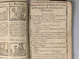 an old book with a page of text on it sitting on top of a table