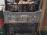 a stack of crates sitting on the floor next to each other