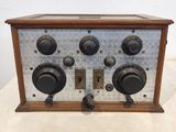 an old radio sitting on top of a table