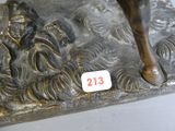 a bronze statue of a horse with a number on it