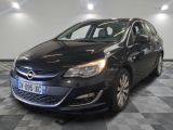 the black opel is parked in the garage on a checkered floor