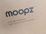 a brown box with a logo on it that says moopz