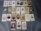 an old photo of a bunch of people sitting on top of a table