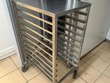 a metal rack with a bunch of trays on top of it