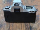 a camera sitting on a wooden table on a table