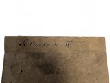a piece of paper with writing on it sitting on top of a table