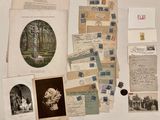 many old letters and pictures on the table