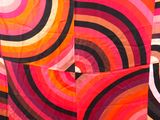 an image of a colorful quilt with many circles on it