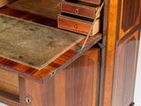 a wooden desk with drawers and a book shelf