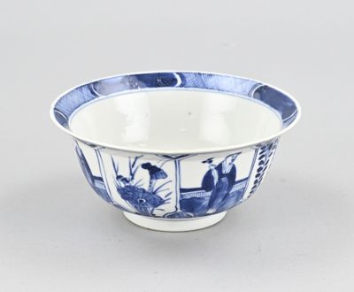 a blue and white bowl sitting on a table