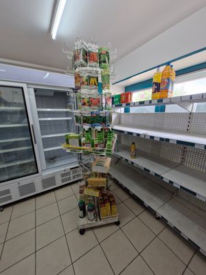 many shelves in the store that have food on them