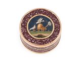 a small round box with a picture of a dog and a house