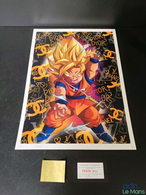the dragon ball poster is on display in a glass case