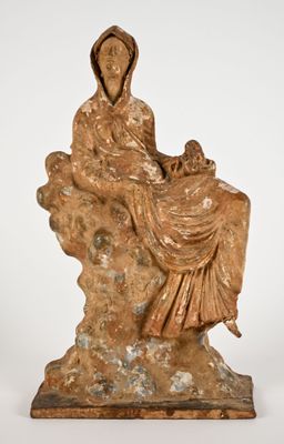 an image of a statue of a woman and child on a rock