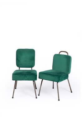 pair of green velvet chairs with metal legs