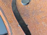 a close up picture of a violin with a black bow