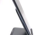a cell phone that is sitting on top of a stand