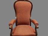 an old chair with a red upholstered upholstered upholstered upholstered upholstered