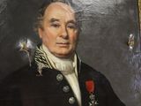 portrait of a man in a military uniform holding a book