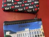 two purses that are sitting next to each other