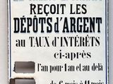 sign on the wall of a building advertising a creditylonias deposit agent