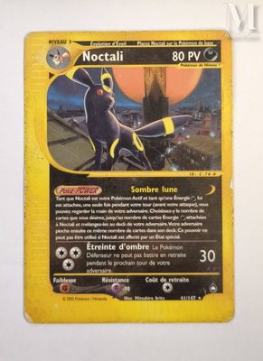 pokemon card with a picture of a batman character on it