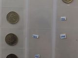 a lot of coins that are in a display case