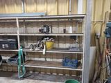 a shelf with tools on it in a garage