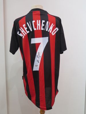 the shirt is black and red with a number 7 on it